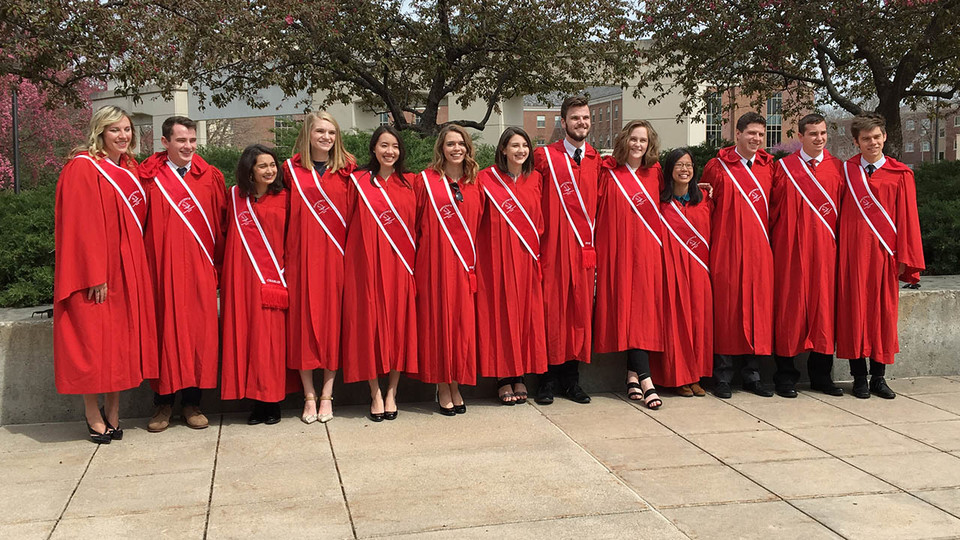 students in red gowns