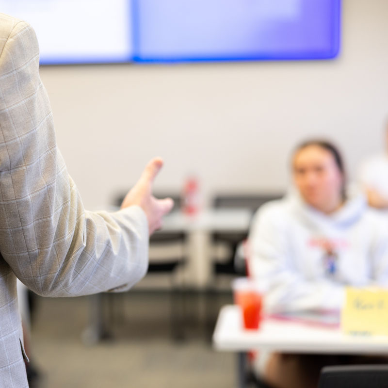 Student listening to a professor.