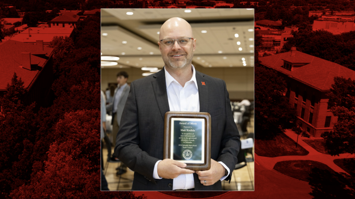 Picture of Matt Kreifels holding NAYC award.