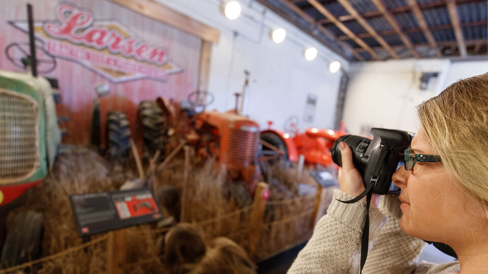 AESC Student taking picture of tractors