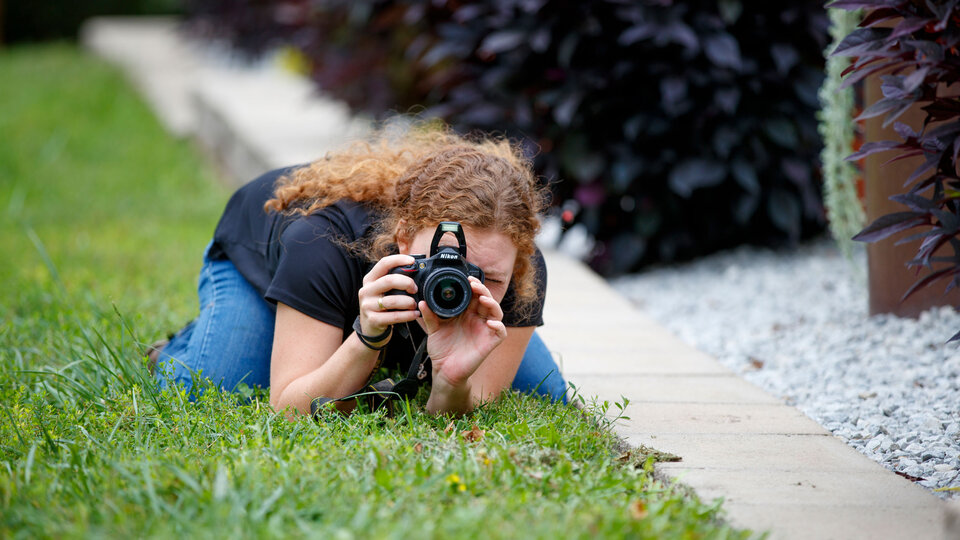 Student taking picture outside