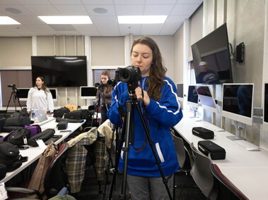 Student working with a camera.